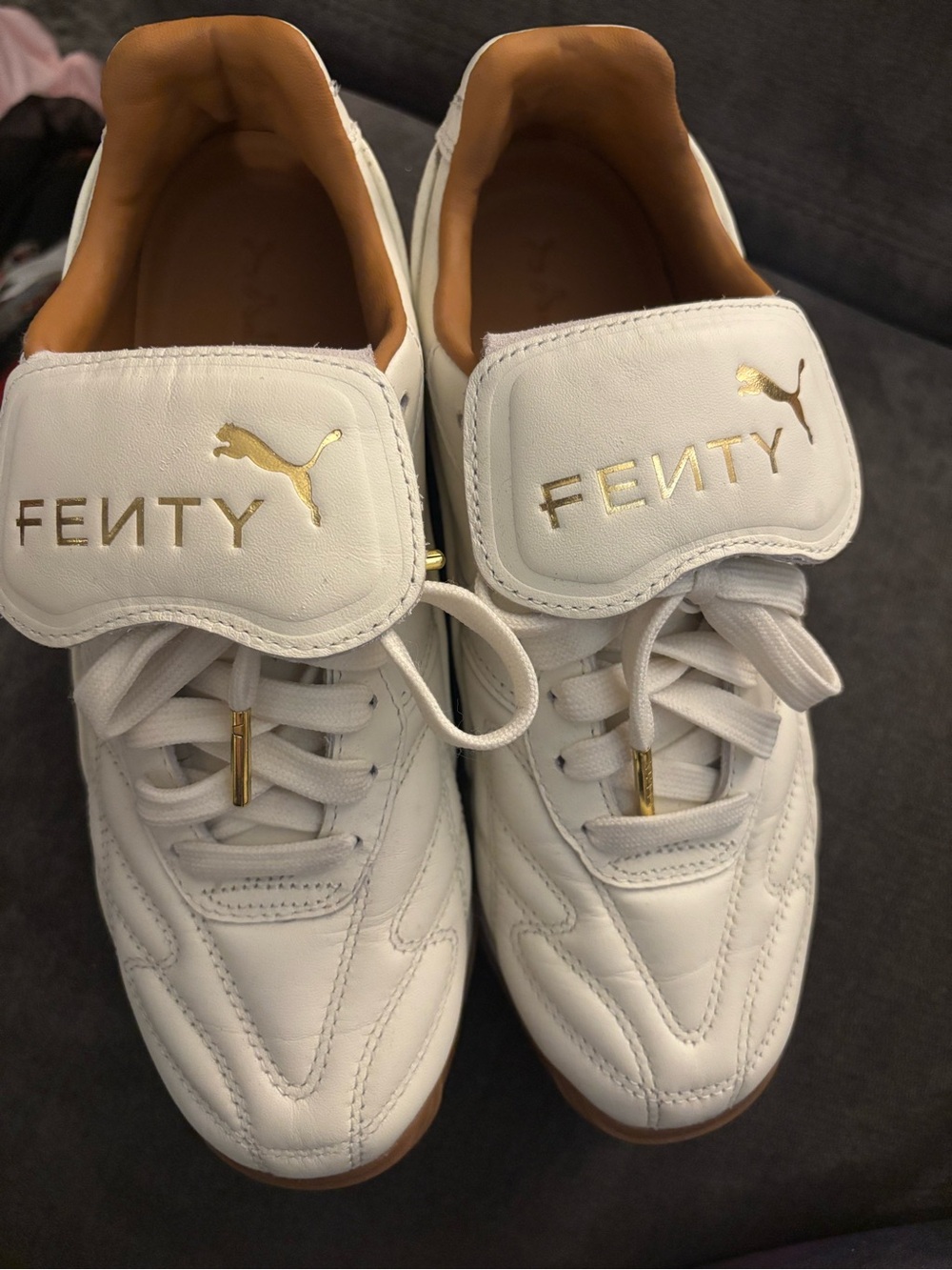 Puma Fenty White Sneakers with Gold Accents
